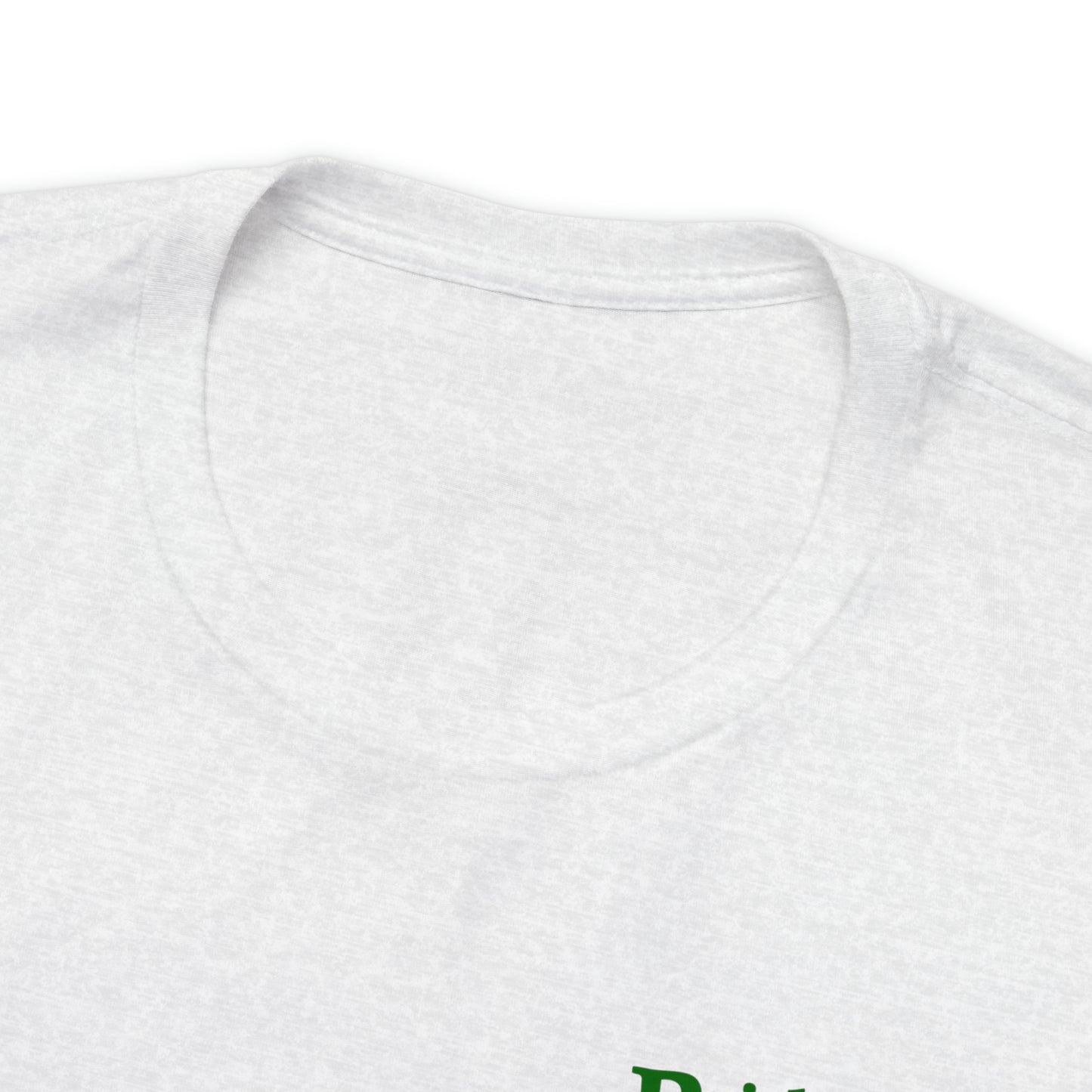 Close-up of the collar and part of the upper section of a Short Sleeve Tee - Small Logo. The T-shirt has green text, partially visible at the lower right corner of the image. The background is white.