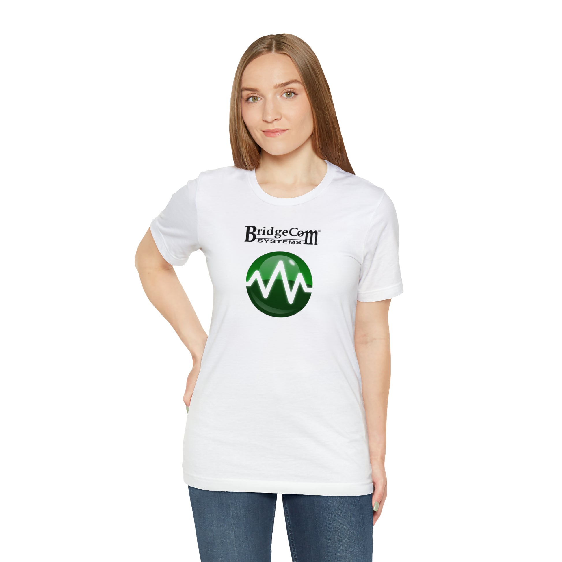 A person with straight, light brown hair is wearing a white Unisex Short Sleeve BridgeCom Tee - Alternate Logo made of soft Airlume cotton. The shirt features the text "BridgeCom Systems" and a green circular logo with a white waveform. Posing with one hand on their hip and maintaining a neutral expression, they stand against a plain white background.