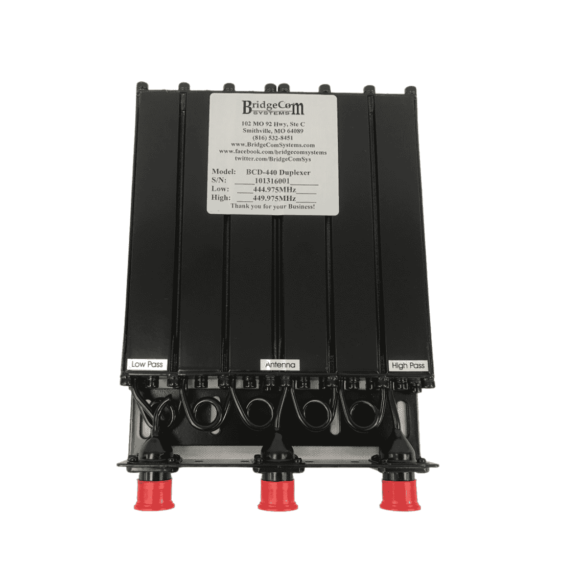 A black BCD-440 UHF Mobile-Type Duplexer by BridgeCom Systems features four red-capped connectors labeled Low Pass, Antenna, and High Pass, plus a silver label on top showing technical specs and contact info.