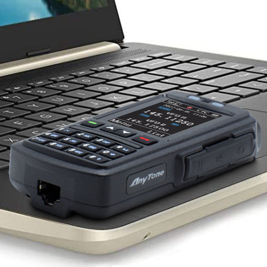 BT 01 Speaker Mic laying flat on laptop keyboard