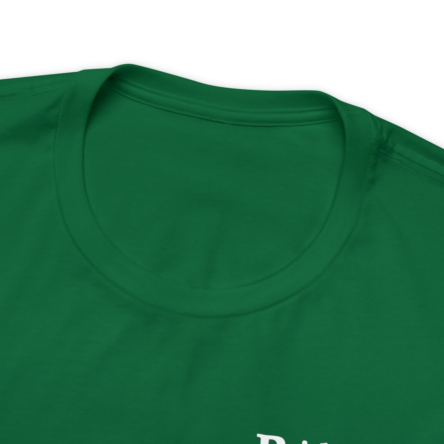 A close-up of the collar area of the Short Sleeve Tee - Small Logo in green, showcasing its round neckline and smooth fabric texture made from Airlume combed cotton. The upper part of a white printed design is barely visible beneath the collar. The background is plain white.