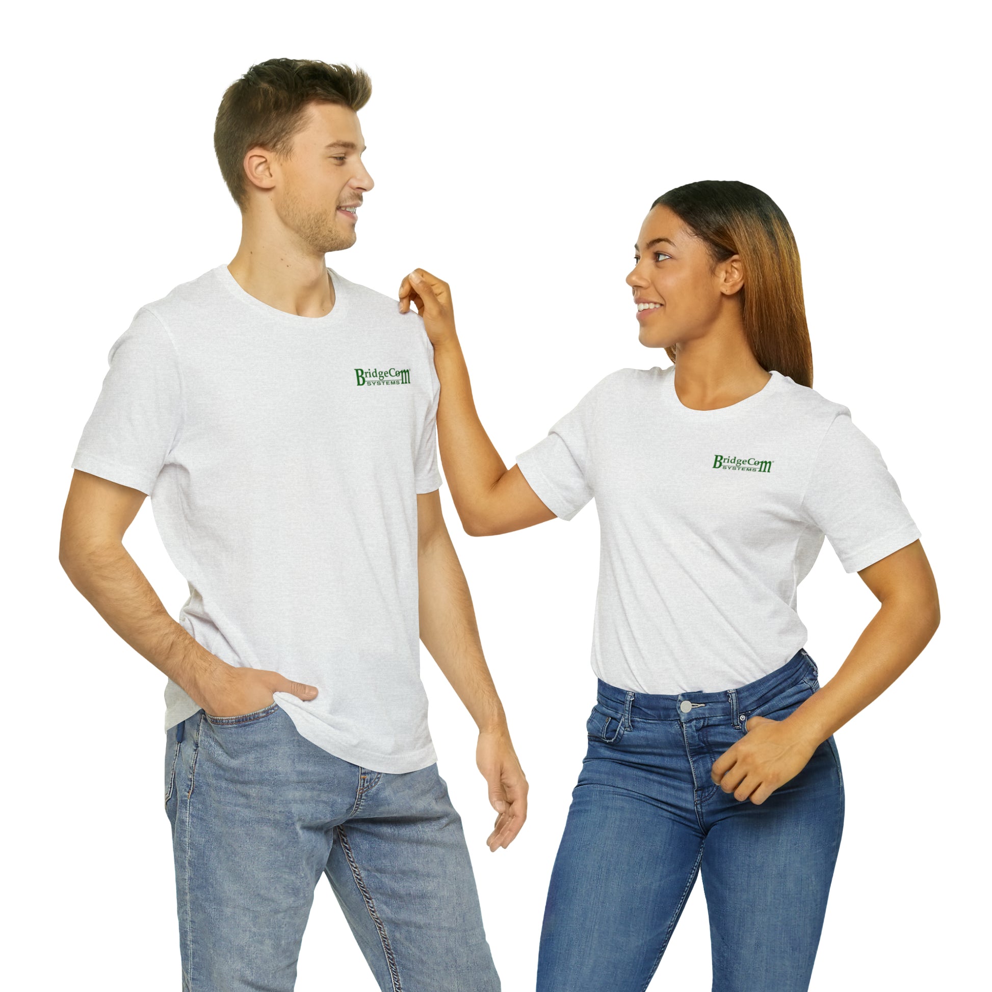 A man and a woman, both casually dressed in Short Sleeve Tees with small green "Bridger CRM" emblems on the left chest, are looking at each other. The woman is touching the man's shoulder. They stand against a plain background, highlighting their clear communication.