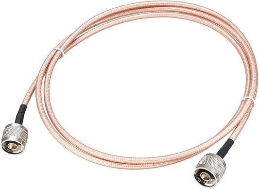 A 6' RG-142 N-to-N Male RF jumper cable with silver connectors and a light copper braided exterior is coiled in a loose loop on a white background.