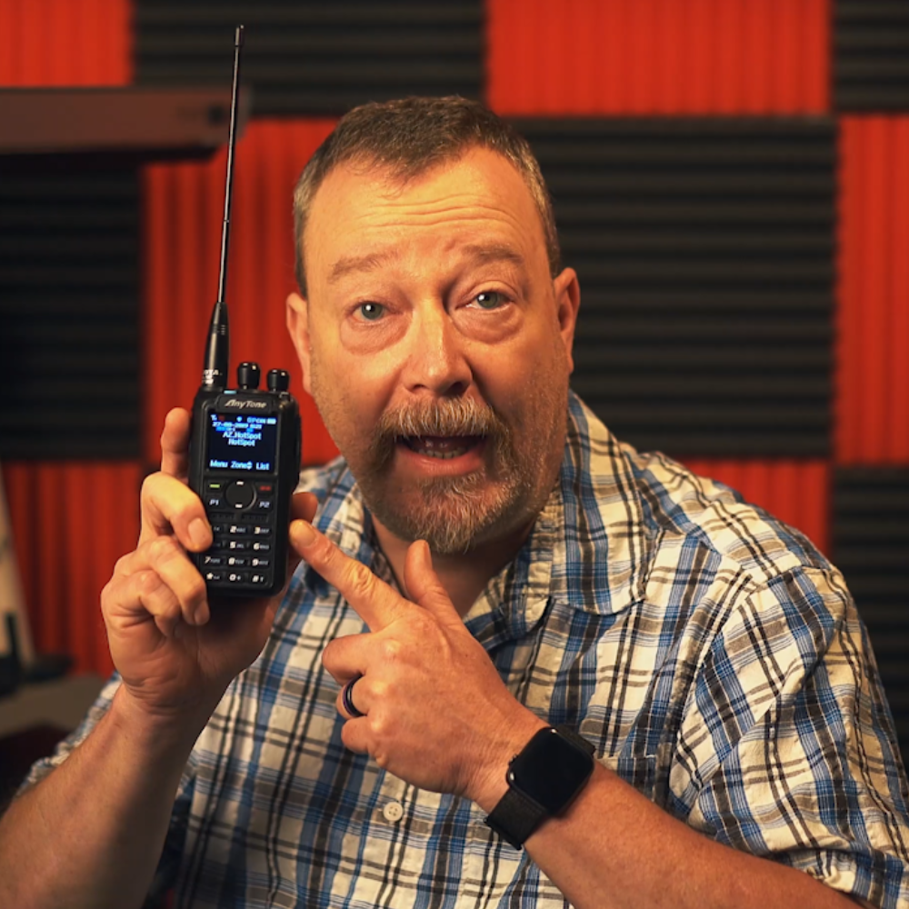 a man holding the anytone 878
