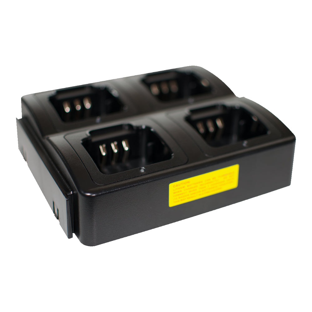 The Four Slot AnyTone 868/878 Rapid Gang Charger, in black with a rectangular design, is perfect for an amateur radio club to charge four HTs like the AnyTone 868-878. Each slot features metal contacts for connecting batteries and there is a yellow caution label with small text visible on the side of the charger. The background is plain white.