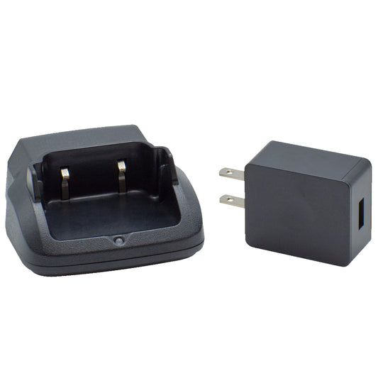 An image displaying the Echo E30 Charger Base w/wall charger in black. The charging dock features an open slot for a battery, and it's placed next to a black wall plug charger equipped with two prongs and a USB port on its side.