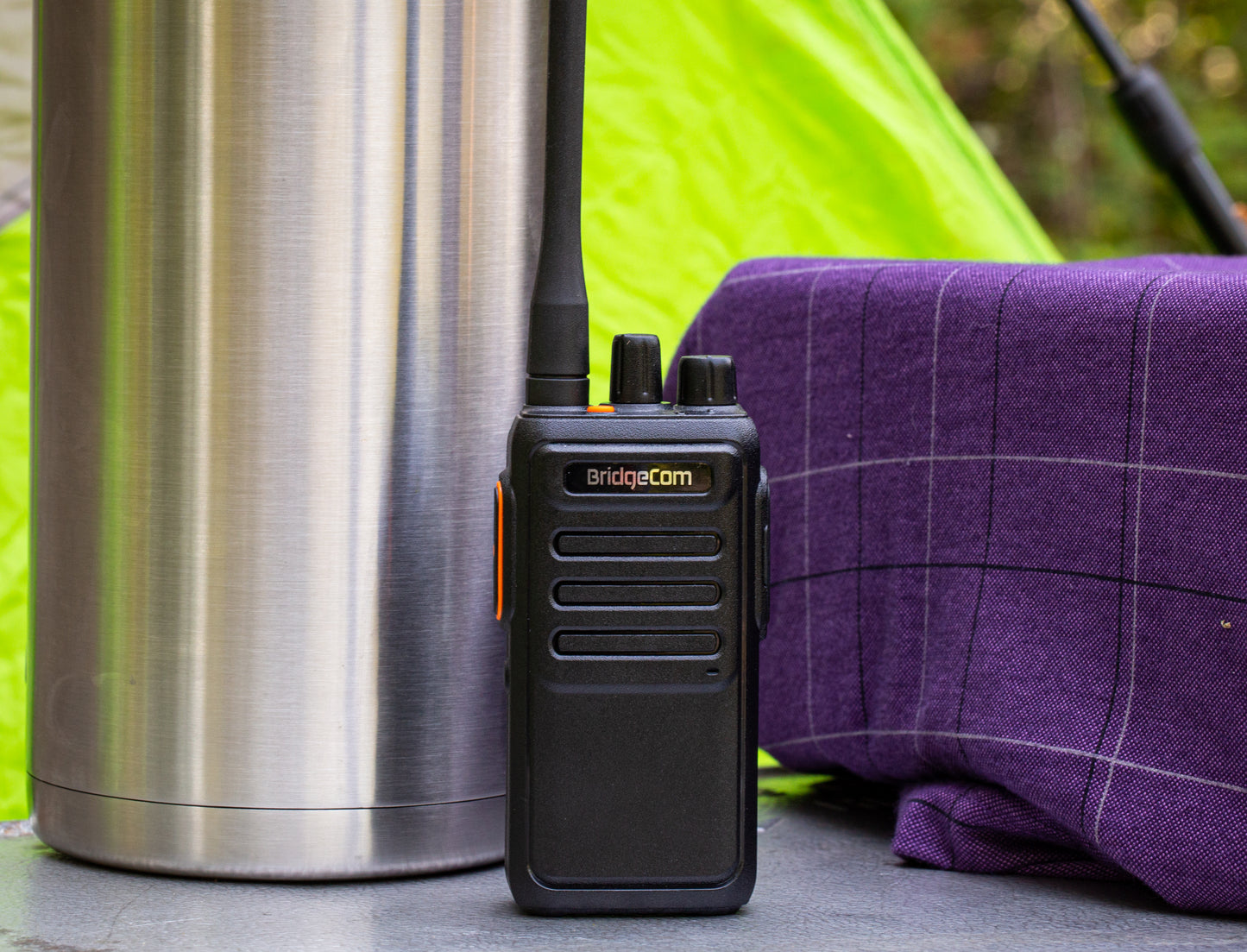 Echo E30 GMRS Radio standing on table outside near campsite