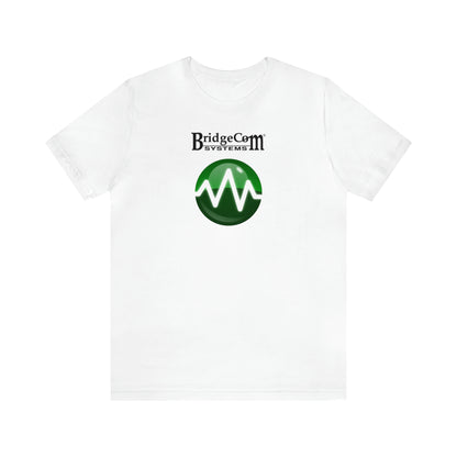 The Unisex Short Sleeve BridgeCom Tee - Alternate Logo features "BridgeCom Systems" text above a green circular logo with a white wave design in the center, all on a white shirt made from premium Airlume cotton. The shirt is displayed against a plain white background.