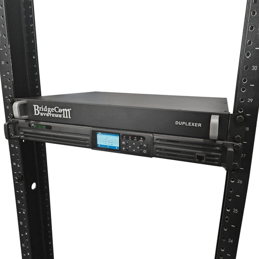 The BridgeCom BCR-GMRS Repeater System with Duplexer is designed for GMRS use, features a digital display and control buttons, and is mounted in a black server rack with numbered slots.