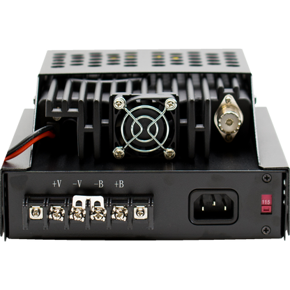 Image of a black metal electronic device with a small fan, various ports, and terminals. The terminals are labeled "+V," "-V," "+B," and "-B." There is also a power switch labeled "115" and a power connector on the right side, resembling components found in an LPH-KEN/S Hood Tri-Band Amateur DMR Mobile Radio.