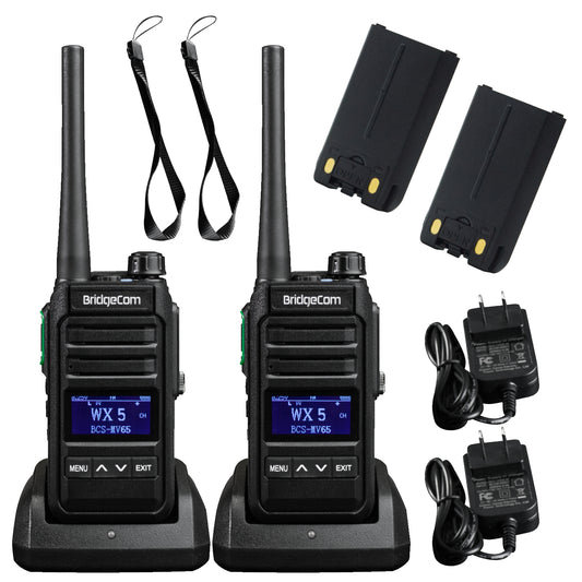 Two black BridgeCom MV-65 2-pack License FREE Walkie Talkies with antennas sit on charging bases, surrounded by 2 batteries, 2 lanyards, and 2 power adapters arranged neatly on a white background.