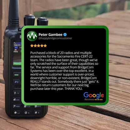 A Commercial Maverick Dual Band DMR/Analog Radio sits outdoors on a wooden surface, topped by Peter Gambee’s Google review commending BridgeCom Systems for great support and equipping the Sacramento Fire CERT-22 team.