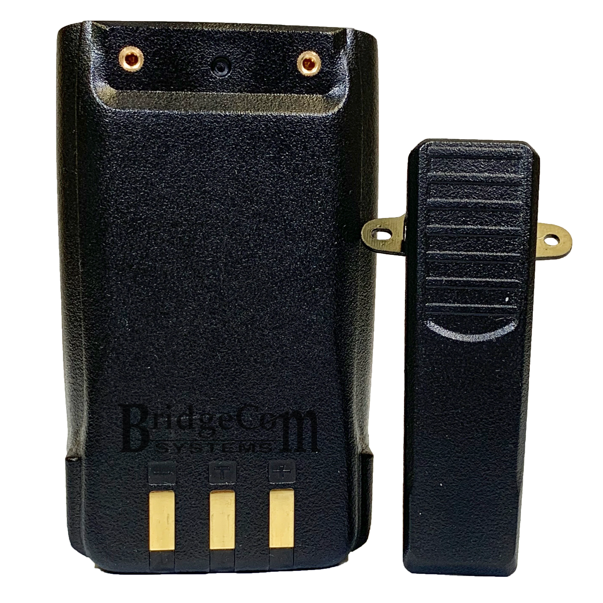 A black two-way radio battery pack with three gold contact points on the bottom and the brand "BridgeCom Systems" printed on the back, compatible with AnyTone HT. Located beside it is a black belt clip attachment secured by two gold screws to the battery pack, making it an ideal addition to your Handheld Accessories Kit.
