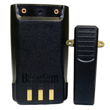 A black two-way radio battery pack with three gold contact points on the bottom and the brand "BridgeCom Systems" printed on the back, compatible with AnyTone HT. Located beside it is a black belt clip attachment secured by two gold screws to the battery pack, making it an ideal addition to your Handheld Accessories Kit.