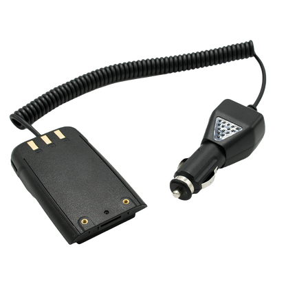 A black coiled car charger cable is connected to a charging adapter equipped with a triangular LED light, along with a separate battery pack featuring gold contacts. The adapter, an integral component of the Handheld Accessories Kit, is designed for use with a vehicle's cigarette lighter socket.