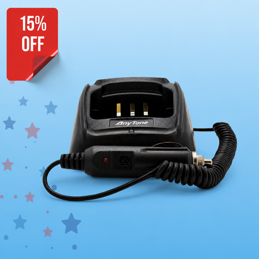 The AnyTone AT-D868UV / AT-D878UV Mobile Battery Charging Kit, in black with a coiled cable and 12V cord, is shown on a blue background with red and blue stars. A red label in the top left corner reads "15% OFF.