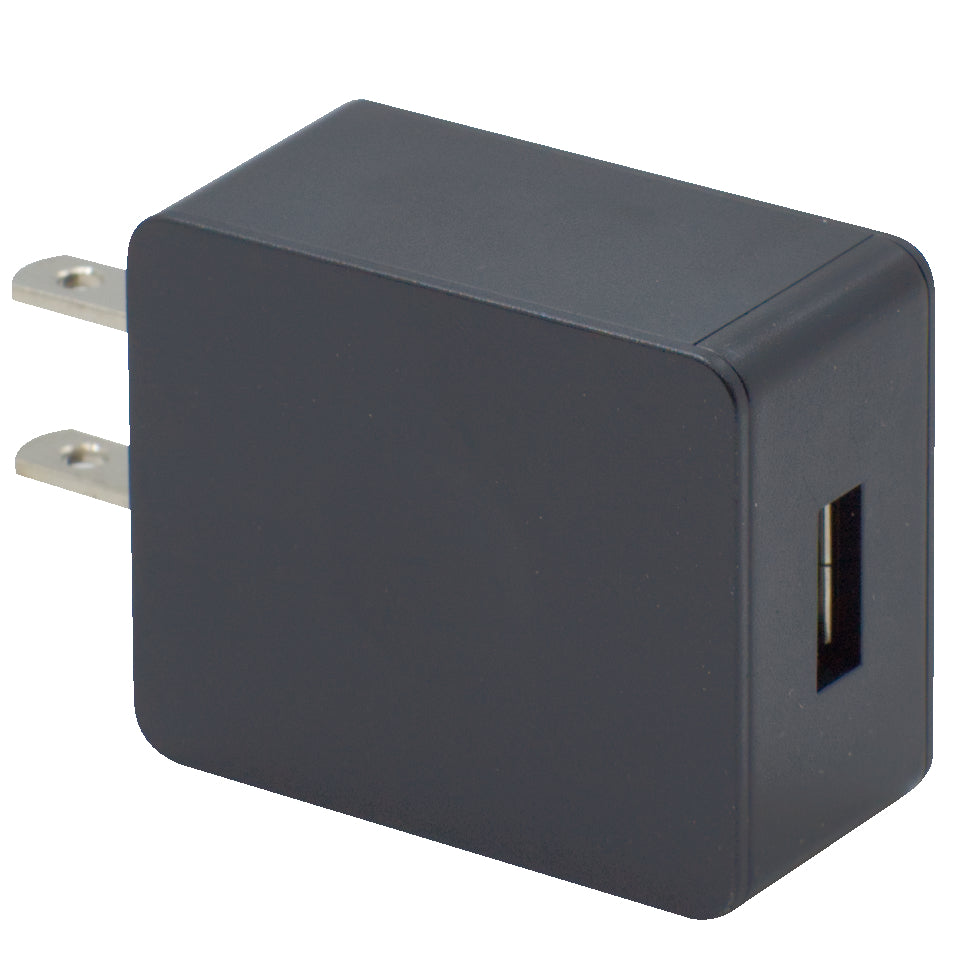 The Echo E30 Charger Base w/wall charger is a black, rectangular USB wall charger featuring two metal prongs for plugging into an electrical outlet. It includes a single USB port on one side, making it ideal for charging your Echo E30 or Echo GMRS handhelds.