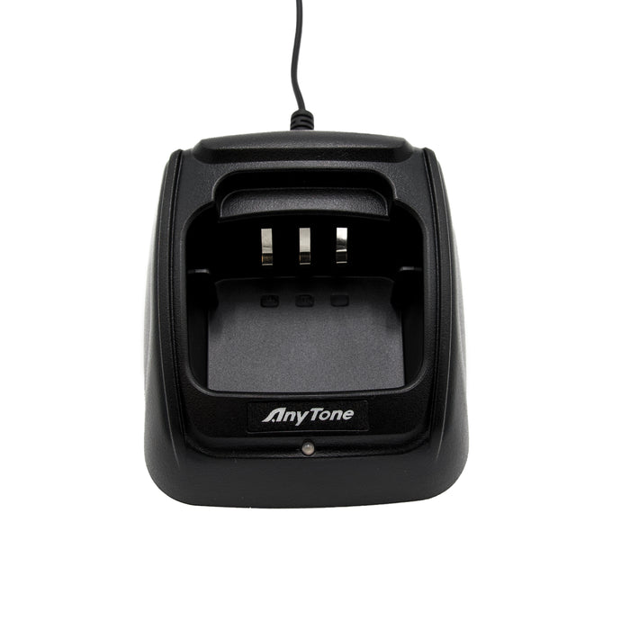 A black AnyTone AT-D868UV / AT-D878UV Charging Base Kit with a connected power cord. The dock features three metal prongs inside and has the AnyTone logo printed on the front. The charging slot is prominently visible, designed to accommodate devices like the AnyTone AT-D868UV and AT-D878UV.