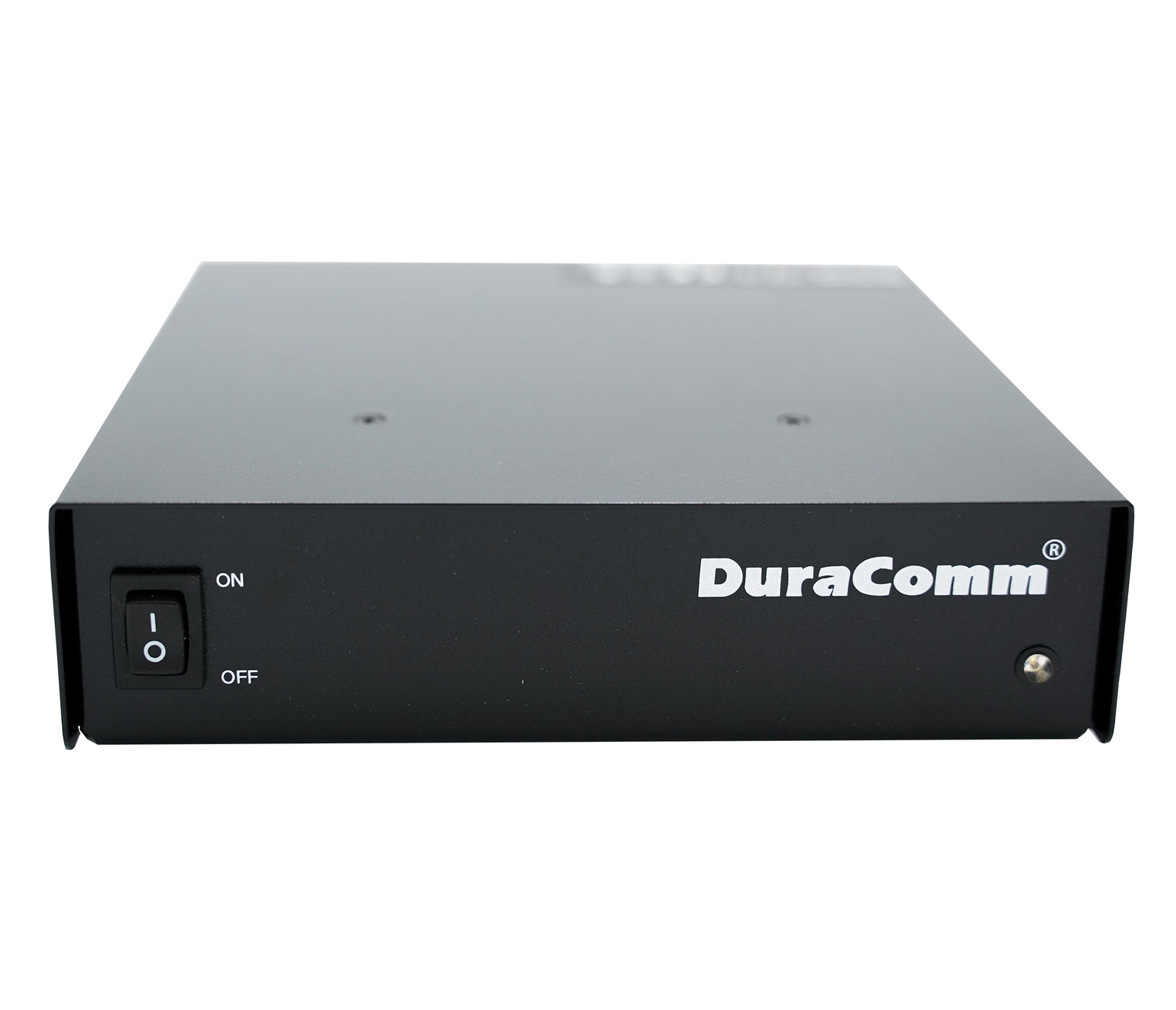 The Duracomm LPX-18BC Power Supply with Built-In Battery Charger is a black rectangular electronic device featuring the brand name "DuraComm" printed in white on the front. It includes a power switch labeled "ON" and "OFF" on the left side, a small LED indicator light on the right, and supports both AC input voltage and DC output voltage.