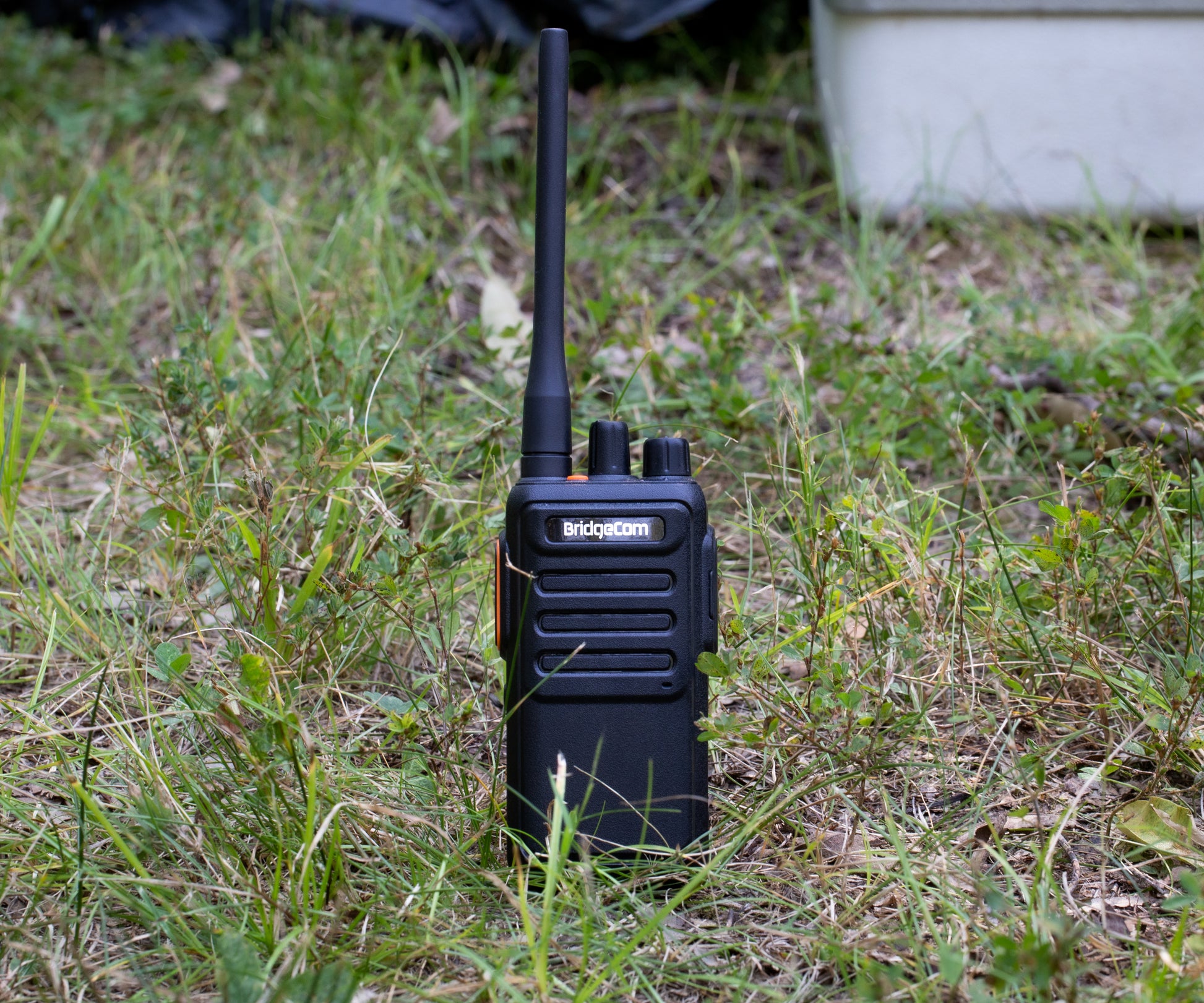 Echo E30 GMRS Radio standing in grass