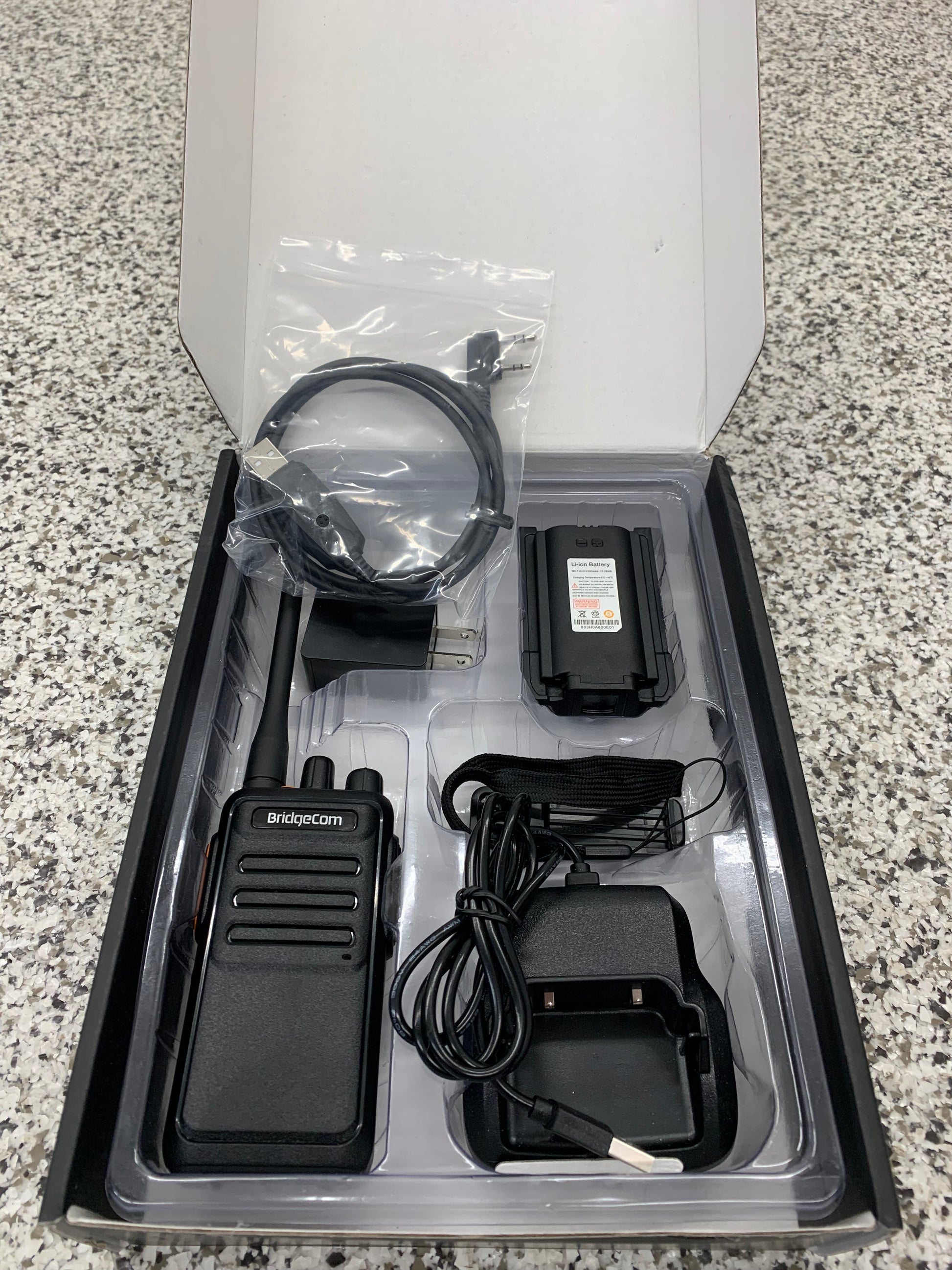 Echo E30 radio inside gift box showing all the accessories
