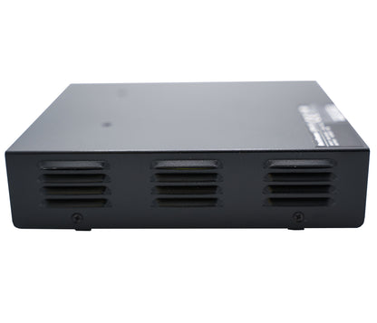 The device is a Duracomm LPX-18BC Power Supply with Built-In Battery Charger, featuring a black rectangular design with vent slits on one side, suggesting forced air cooling. It appears to be intended for professional or industrial use and boasts a smooth, matte finish.