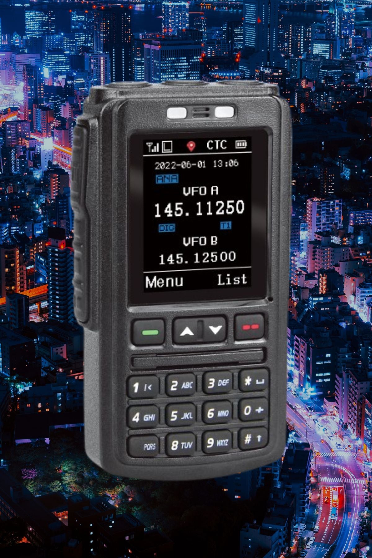 A black 578 Bluetooth Speaker Mic Programming Fee with various buttons and a digital display is shown against a nighttime cityscape of illuminated buildings and skyscrapers. The screen shows two frequency channels labeled "VFO A" and "VFO B" with respective numeric values, showcasing its compatibility with the advanced mobile radio system.