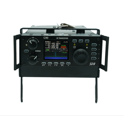 A black rectangular SDR HF transceiver labeled "Xiegu G90-H1 Cooling Bracket" with a digital display showing frequencies and other information. It features various knobs, buttons, connectors, and a smart temperature sensor integrated into its design. Additionally, it includes a foldable stand for positioning.