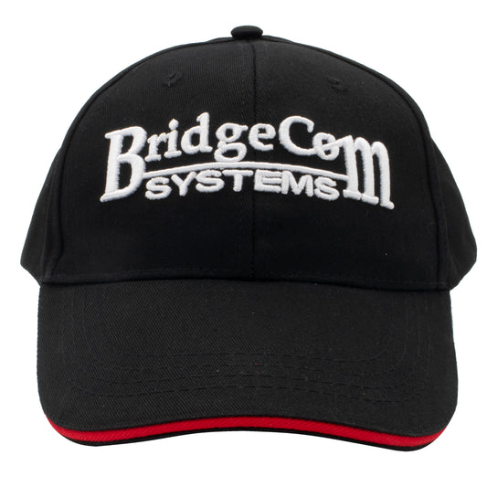 The BridgeCom Systems Hat is a black baseball cap, perfect for Amateur Radio enthusiasts. It features "BridgeCom Systems" embroidered in white on the front and a curved bill with a striking red accent along the edge.